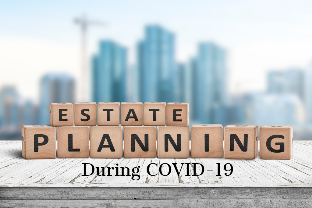 Estate Planning during COVID-19 on wood blocks with city in background Massachusetts