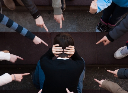 a lonely sad kid being bullied from his mates. A bullying scene