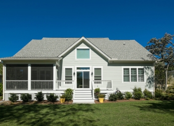 Rear elevation of beautiful home with landscaped garden.